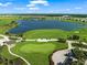 Aerial view of golf course, lake, and residential area at 16415 Isola Pl, Bradenton, FL 34211