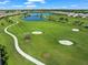 Aerial view of community, showcasing homes and golf course at 16415 Isola Pl, Bradenton, FL 34211