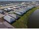 Aerial view of home and large lot by lake at 16415 Isola Pl, Bradenton, FL 34211