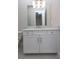 Bathroom vanity with white cabinets and quartz countertop at 16415 Isola Pl, Bradenton, FL 34211