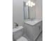 Modern bathroom with white vanity and toilet at 16415 Isola Pl, Bradenton, FL 34211
