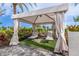 Relaxing cabana with lounge chairs and shade at 16415 Isola Pl, Bradenton, FL 34211