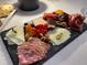 Gourmet charcuterie board with cheeses, meats, and fruit at 16415 Isola Pl, Bradenton, FL 34211