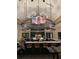 Upscale community bar with seating and large TV at 16415 Isola Pl, Bradenton, FL 34211