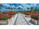 Landscaped community garden with various flowers at 16415 Isola Pl, Bradenton, FL 34211