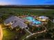 Luxury community pool and clubhouse at night at 16415 Isola Pl, Bradenton, FL 34211