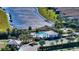 Community pool with cabana and adjacent lake at 16415 Isola Pl, Bradenton, FL 34211