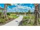 Entrance to the community dog park with paved pathway at 16415 Isola Pl, Bradenton, FL 34211