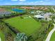 Community dog park with fenced area, benches, and shaded seating at 16415 Isola Pl, Bradenton, FL 34211