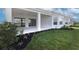 Home exterior showcasing a covered patio and landscaping at 16415 Isola Pl, Bradenton, FL 34211