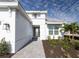 Landscaped front yard with walkway leading to house entrance at 16415 Isola Pl, Bradenton, FL 34211