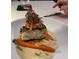 Delicious pan-seared fish dish with carrots and sauce at 16415 Isola Pl, Bradenton, FL 34211