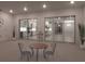 Relaxing patio with glass doors opening to kitchen at 16415 Isola Pl, Bradenton, FL 34211