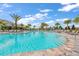 Large resort-style pool with plenty of lounge chairs at 16415 Isola Pl, Bradenton, FL 34211