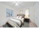 Bedroom with a bed, nightstand, and window at 1771 Ringling Blvd Blvd # 1009, Sarasota, FL 34236