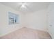 Simple bedroom with neutral walls, carpet, and a window at 1771 Ringling Blvd Blvd # 1009, Sarasota, FL 34236