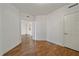 Simple bedroom with wood flooring and access to other rooms at 1771 Ringling Blvd Blvd # 1009, Sarasota, FL 34236