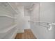 Walk-in closet with wire shelving and hanging rods at 1771 Ringling Blvd Blvd # 1009, Sarasota, FL 34236