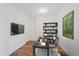 Home office with built-in shelving and a workspace at 1771 Ringling Blvd Blvd # 1009, Sarasota, FL 34236