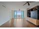 Bright living room with hardwood floors and balcony access at 1771 Ringling Blvd Blvd # 1009, Sarasota, FL 34236