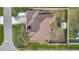 Bird's-eye view of a single-Gathering home, showcasing its roofline and backyard at 23039 Worth Ave, Port Charlotte, FL 33954