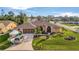Attractive single-Gathering home with a well-manicured lawn and a two-car garage at 23039 Worth Ave, Port Charlotte, FL 33954