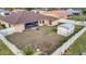 Backyard of a single-Gathering home with a storage shed and a fenced-in yard at 23039 Worth Ave, Port Charlotte, FL 33954