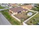 Backyard view of a house with a storage shed and fenced-in yard at 23039 Worth Ave, Port Charlotte, FL 33954