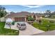 Single-Gathering home with a boat, a two-car garage, and a manicured lawn at 23039 Worth Ave, Port Charlotte, FL 33954
