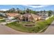 Single-Gathering home with a spacious yard, palm trees, and a two-car garage at 23039 Worth Ave, Port Charlotte, FL 33954