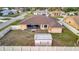 Backyard of a single-Gathering home with storage shed and privacy fence at 23039 Worth Ave, Port Charlotte, FL 33954