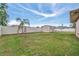 Fenced backyard with storage shed and grassy area at 23039 Worth Ave, Port Charlotte, FL 33954