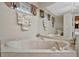 Relaxing bathroom with corner bathtub and window seat at 23039 Worth Ave, Port Charlotte, FL 33954