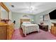Guest bedroom with double bed, wood dresser, and carpet at 23039 Worth Ave, Port Charlotte, FL 33954