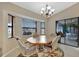 Casual dining area with table and chairs, access to screened porch at 23039 Worth Ave, Port Charlotte, FL 33954
