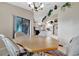 Open dining area with octagonal table and view into kitchen at 23039 Worth Ave, Port Charlotte, FL 33954