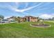 Single-story home with attractive landscaping and a two-car garage at 23039 Worth Ave, Port Charlotte, FL 33954