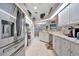 Modern kitchen with white cabinets, granite counters, and stainless steel appliances at 23039 Worth Ave, Port Charlotte, FL 33954