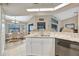 Modern kitchen with white cabinets, granite counters and stainless steel appliances at 23039 Worth Ave, Port Charlotte, FL 33954