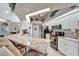 Modern kitchen with white cabinets, granite counters, and stainless steel appliances at 23039 Worth Ave, Port Charlotte, FL 33954