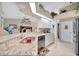 Modern kitchen with white cabinets, granite counters, and stainless steel appliances at 23039 Worth Ave, Port Charlotte, FL 33954