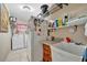 Laundry room with washer, dryer, and extra storage at 23039 Worth Ave, Port Charlotte, FL 33954
