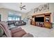 Living room with sectional sofa and large TV at 23039 Worth Ave, Port Charlotte, FL 33954