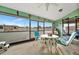 Bright, screened porch with seating area and lovely backyard view at 23039 Worth Ave, Port Charlotte, FL 33954