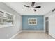 Bright bedroom with ceiling fan, new flooring, and a fresh coat of paint at 2430 Sunnyside Ln, Sarasota, FL 34239