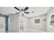 Bedroom with ceiling fan, window, and access to the bathroom at 2430 Sunnyside Ln, Sarasota, FL 34239