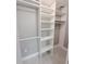 Spacious closet with shelves and hanging rods at 2430 Sunnyside Ln, Sarasota, FL 34239