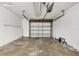 Clean garage with automatic opener and ample storage space at 2430 Sunnyside Ln, Sarasota, FL 34239