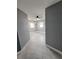 Bright hallway with gray walls, tile floors and ceiling fan at 2430 Sunnyside Ln, Sarasota, FL 34239