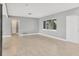 Bright living room with large windows and neutral color palette at 2430 Sunnyside Ln, Sarasota, FL 34239